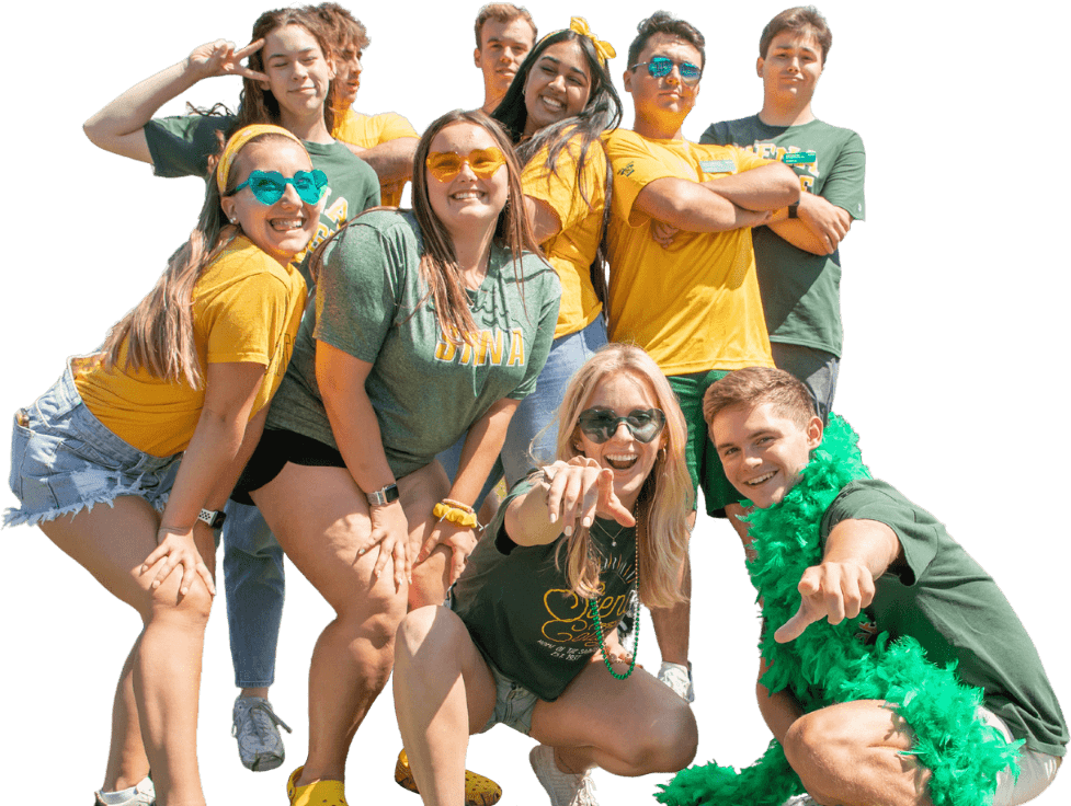 Group of Siena students wearing green and yellow Siena gear and posing in the sunshine