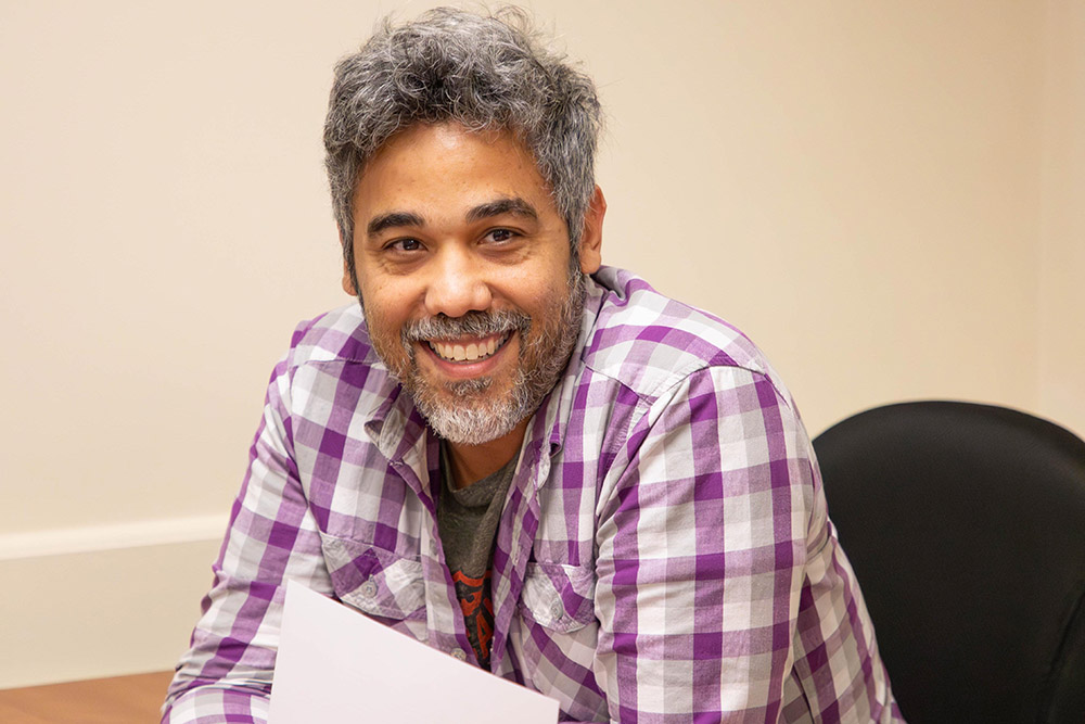 A Siena Gradate student smiles during a class lesson